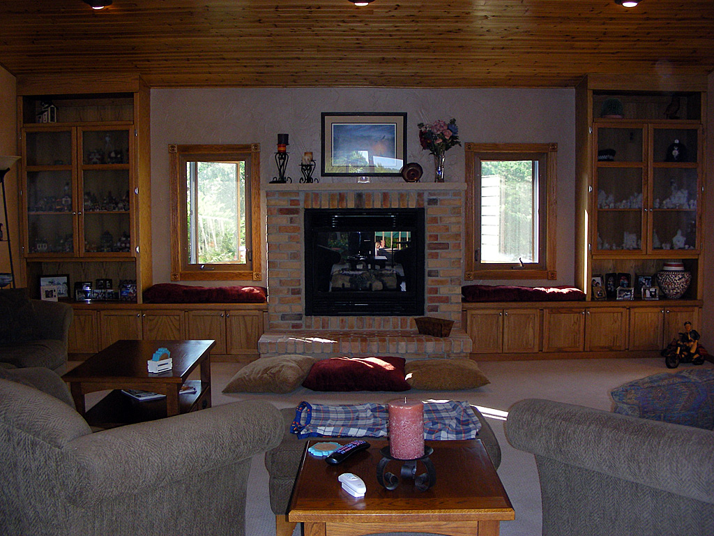 Custom cabinets flanking the fireplace