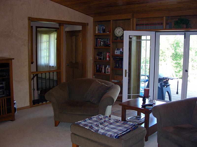 Custom bookcases flanking the French doors on the left side