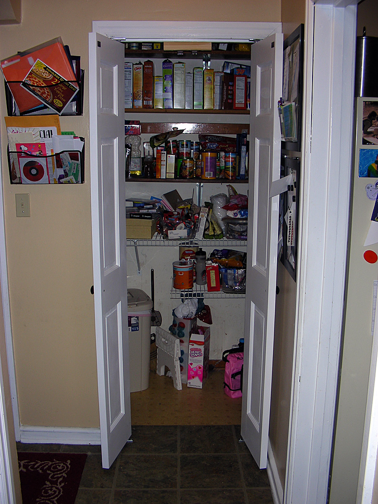 The French doors open, allowing easy access to the closet