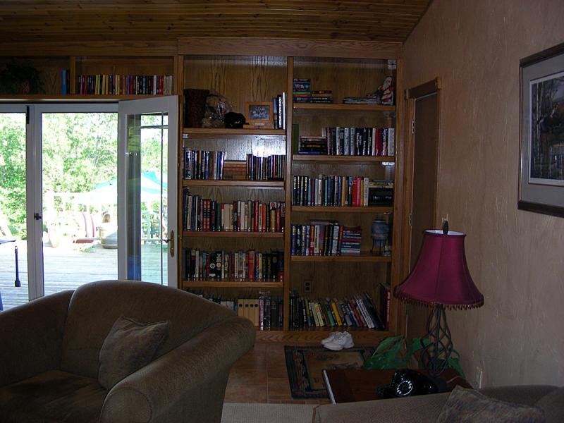 Custom bookcases flanking the French doors on the right side